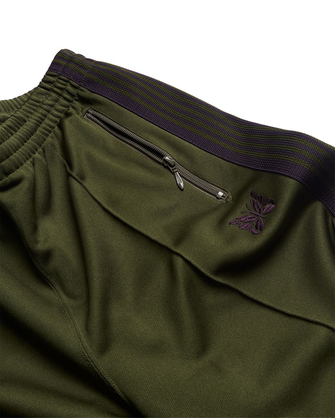 Calça track needles